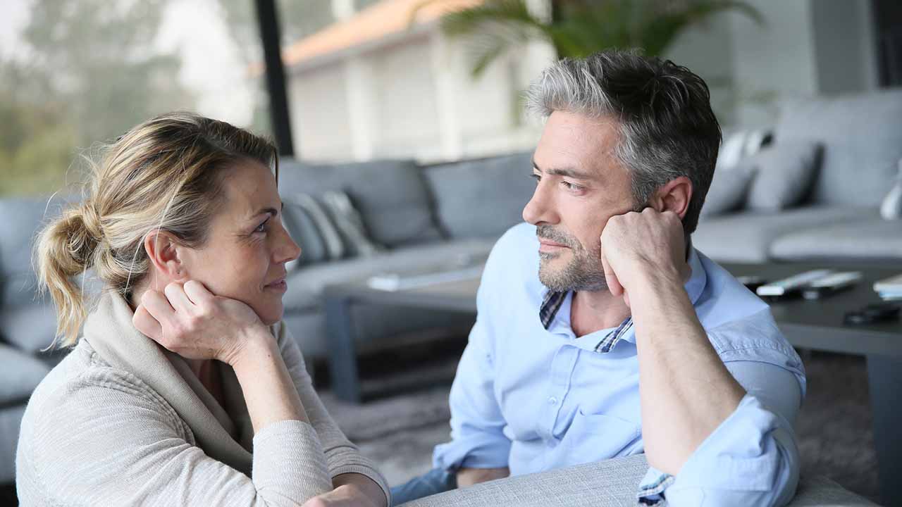 couple turned towards each other in discussion.