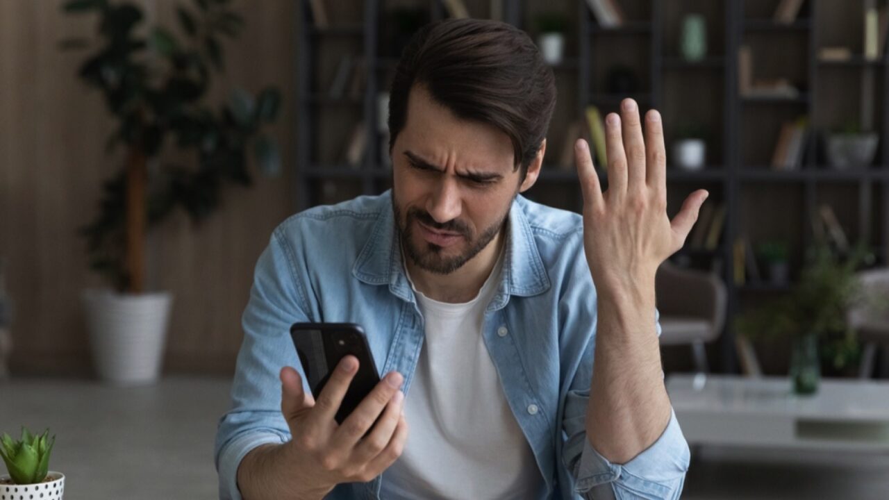 Upset angry man with mobile