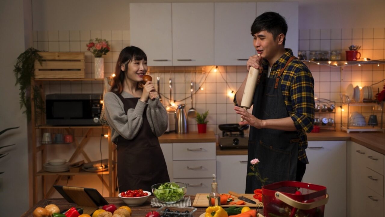 Asian couples cooking and enjoying