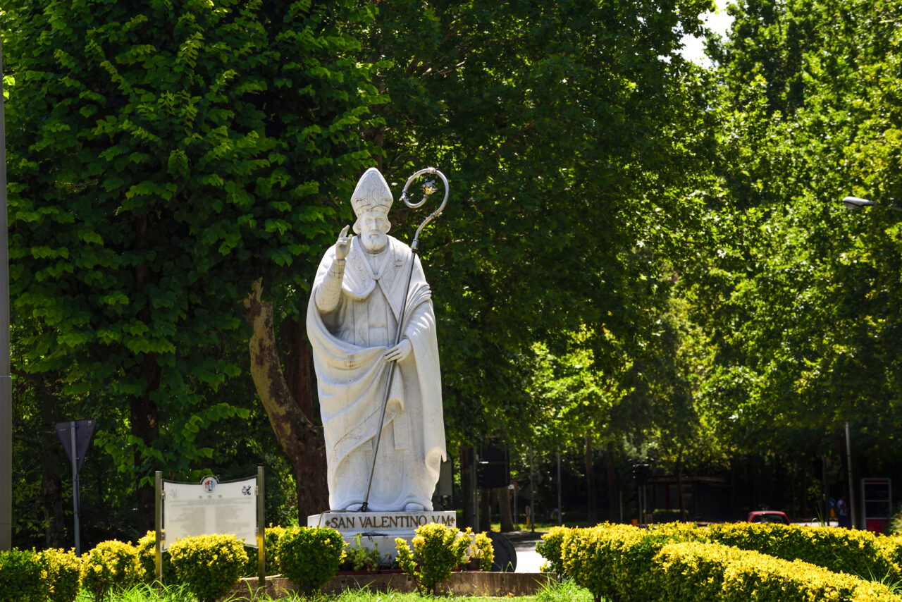 Statue of Saint Valentine who protects lovers in a garden.